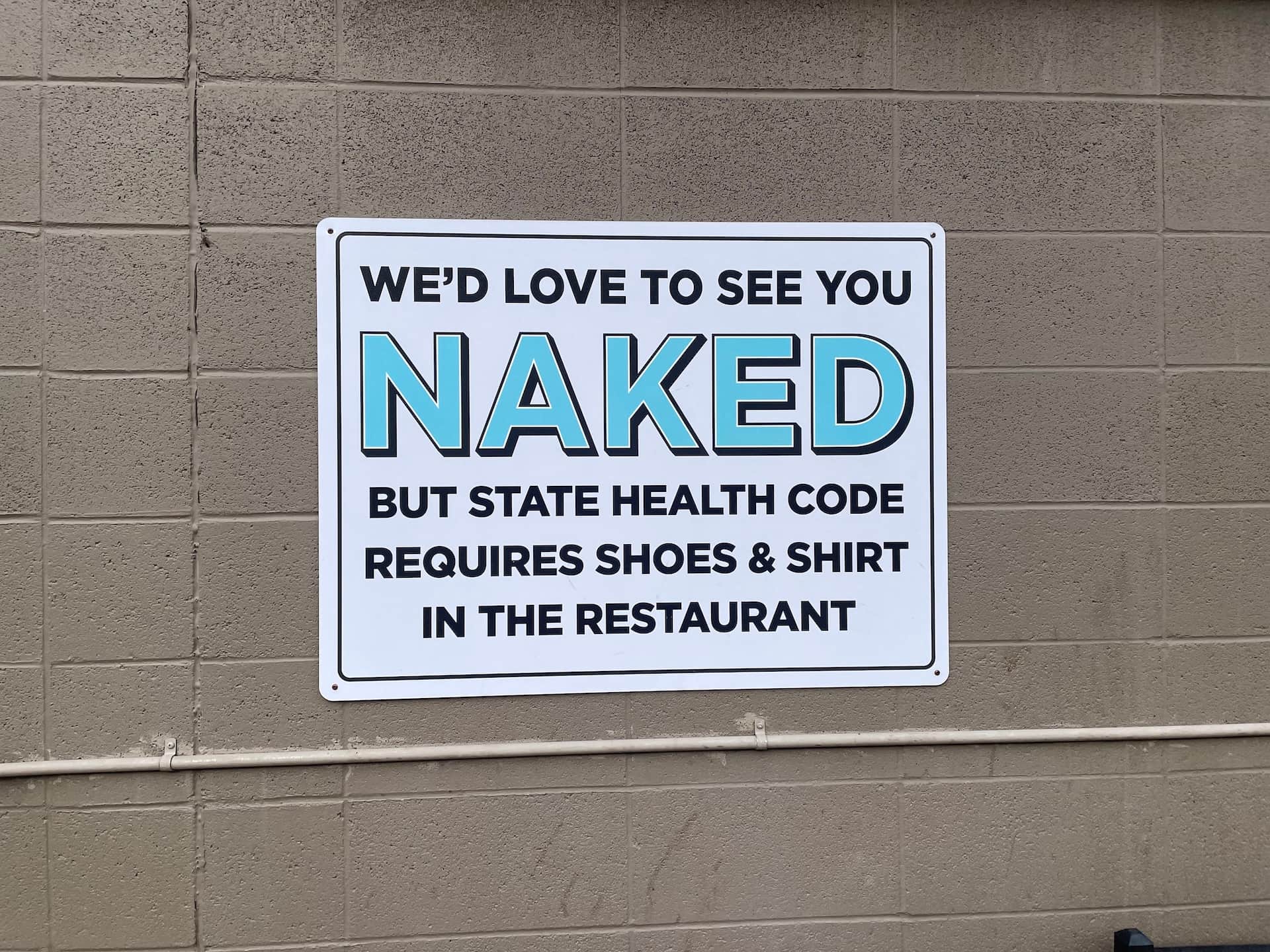 HELENA, Mont. — A sign posted at Broadwater Hot Springs outlines dress requirements for patrons entering the restaurant, Thursday, Dec. 11, 2025.